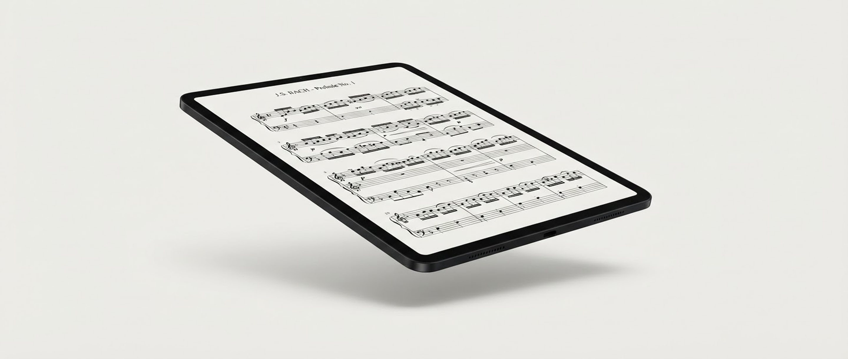 Concept render of Takt One floating at an angle, showing a page of Bach's Prelude in C major on its matte screen.